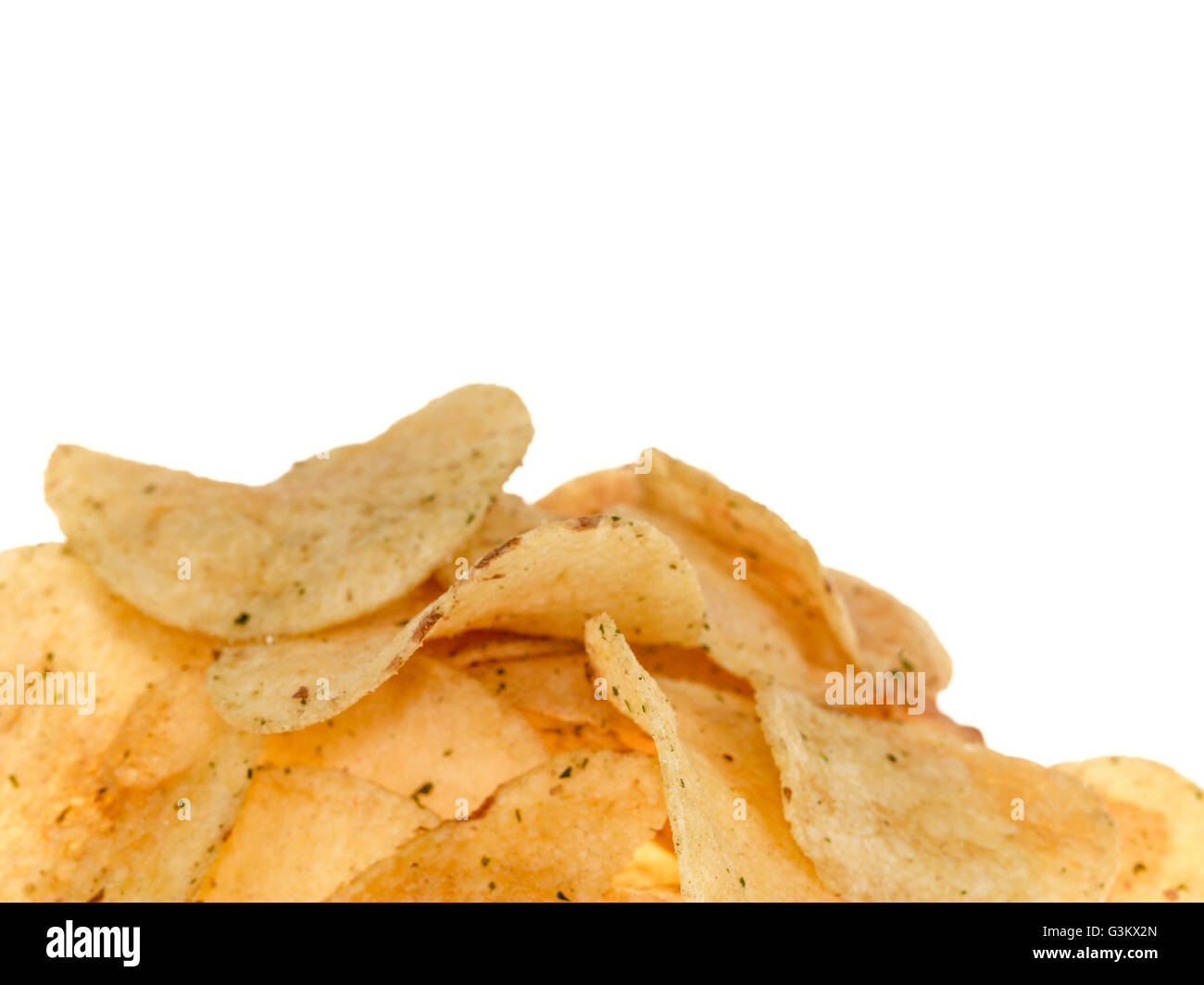 Handful of Flavored Potato Crisps Against a Plain White Background With Copy Space Stock Photo
