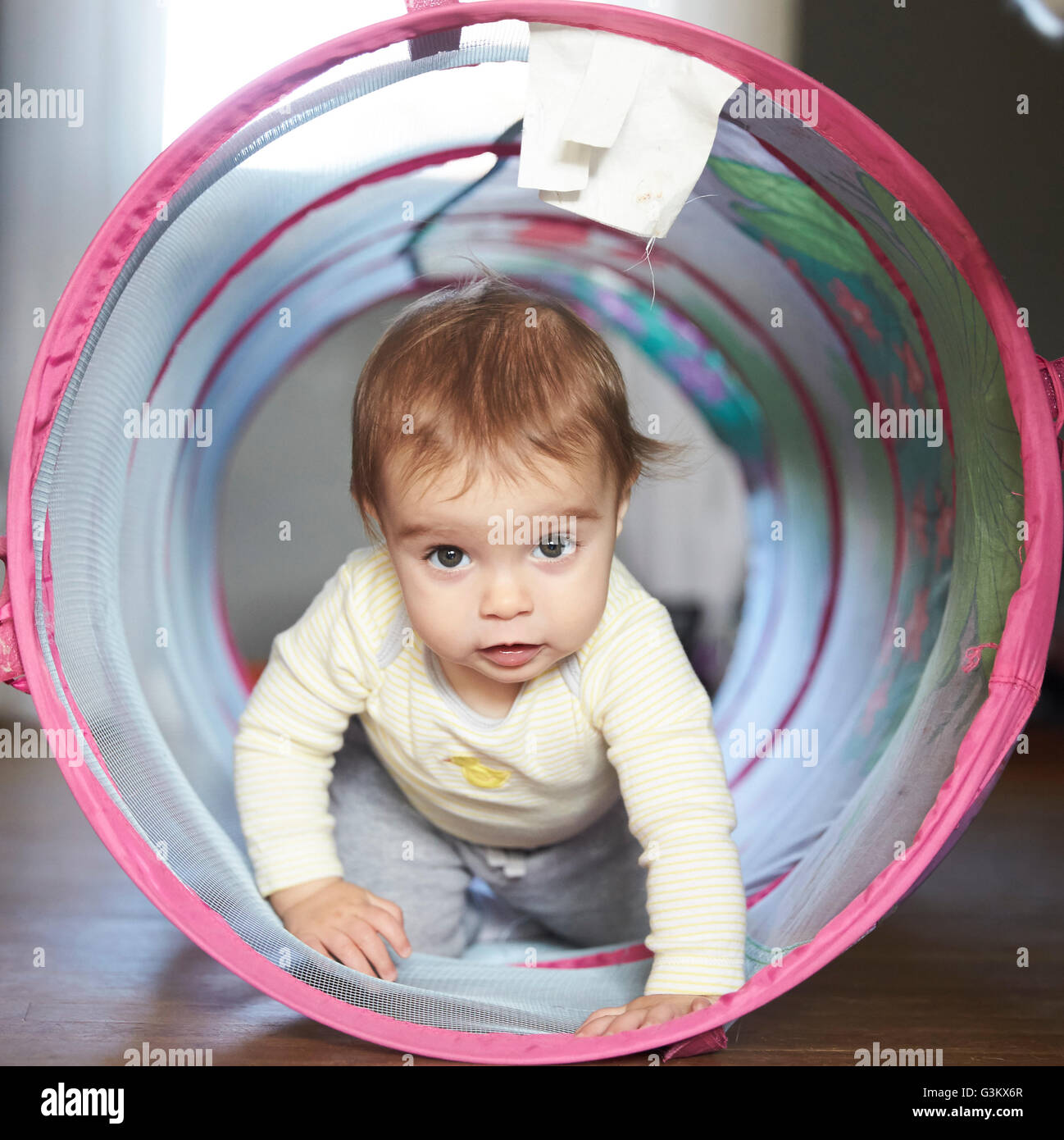 Baby crawling through tunnel hires stock photography and images Alamy