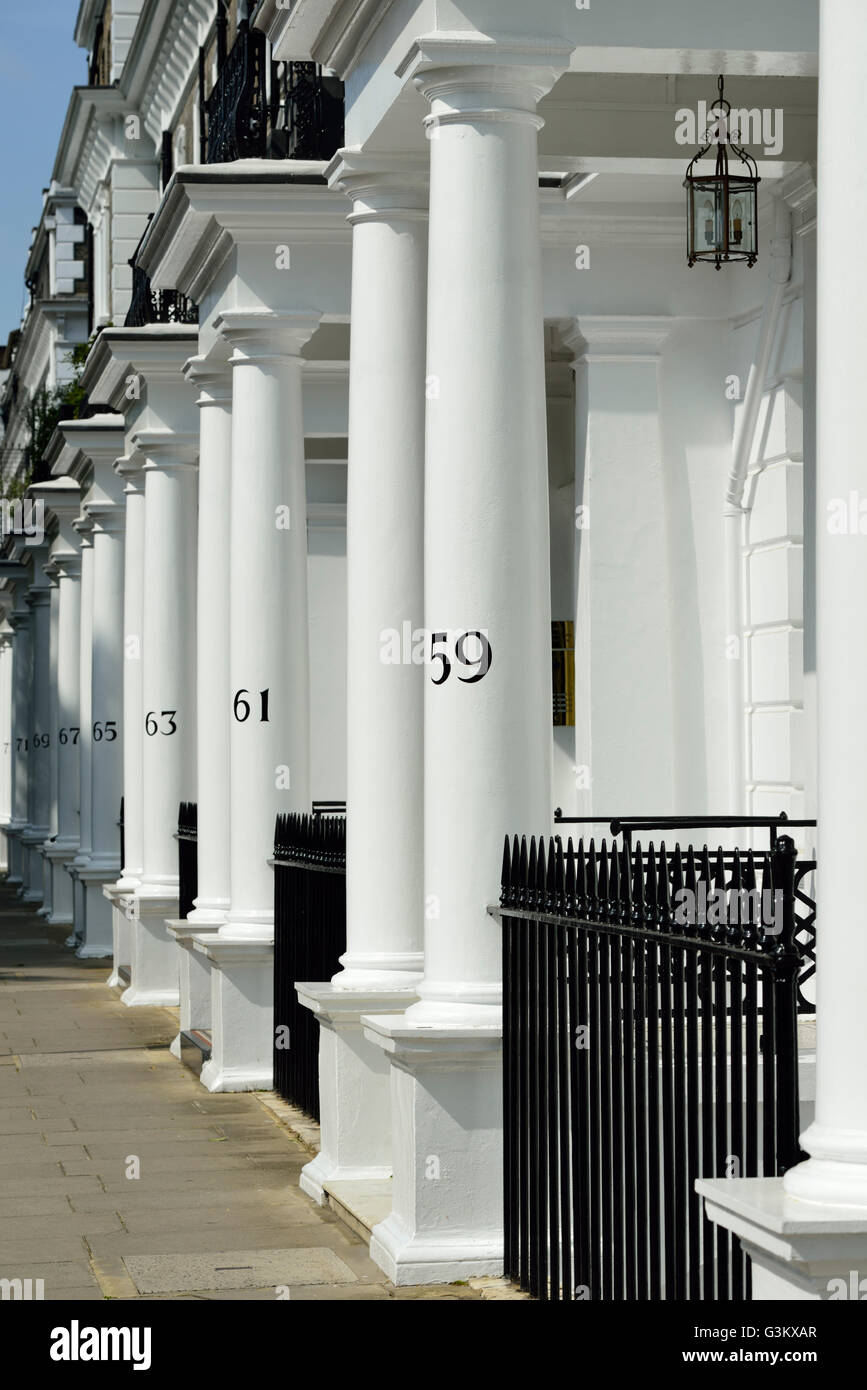 Stucco fronted terrace house numbers, Onslow Square, South Kensington, London, United Kingdom Stock Photo