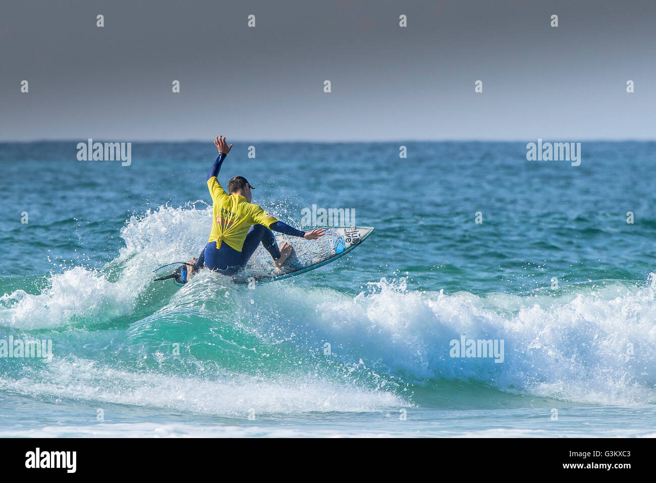 A surfer in spectacular action as he competes in a UK Pro Surf Tour competition at Fistral in Newquay, Cornwall. UK. Stock Photo