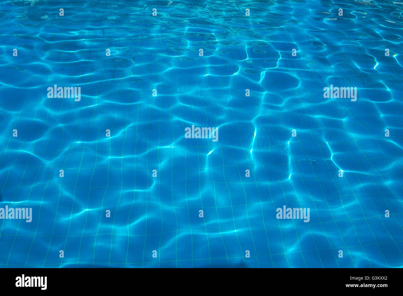 Water reflections, sun reflections on water in a swimming pool Stock Photo