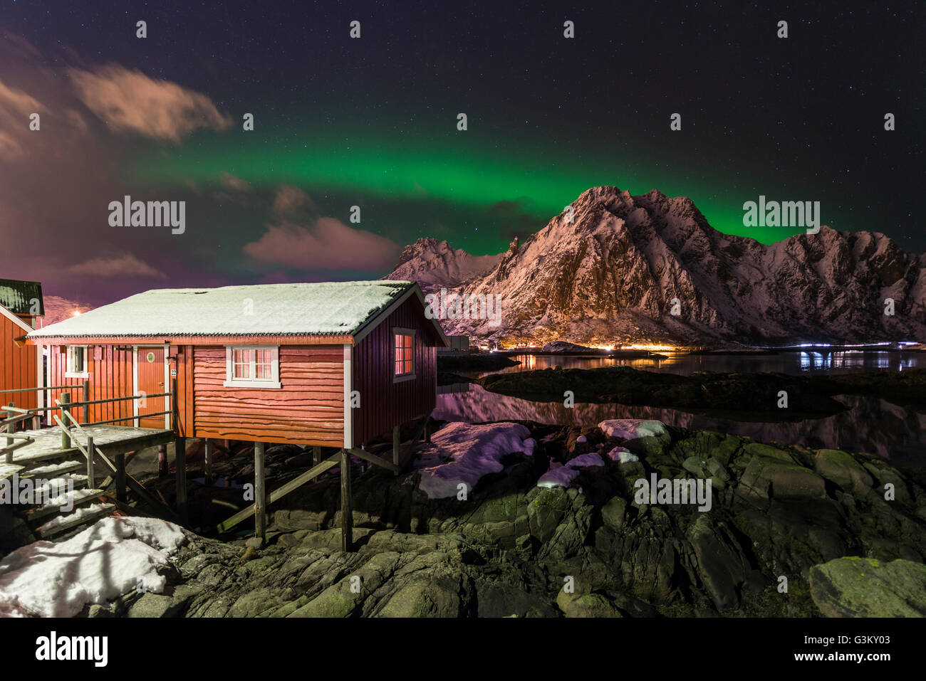 Northern lights or aurora borealis over Rorbuer fishing cottage, Svolvær, Austvågøy, Lofoten, Norway Stock Photo