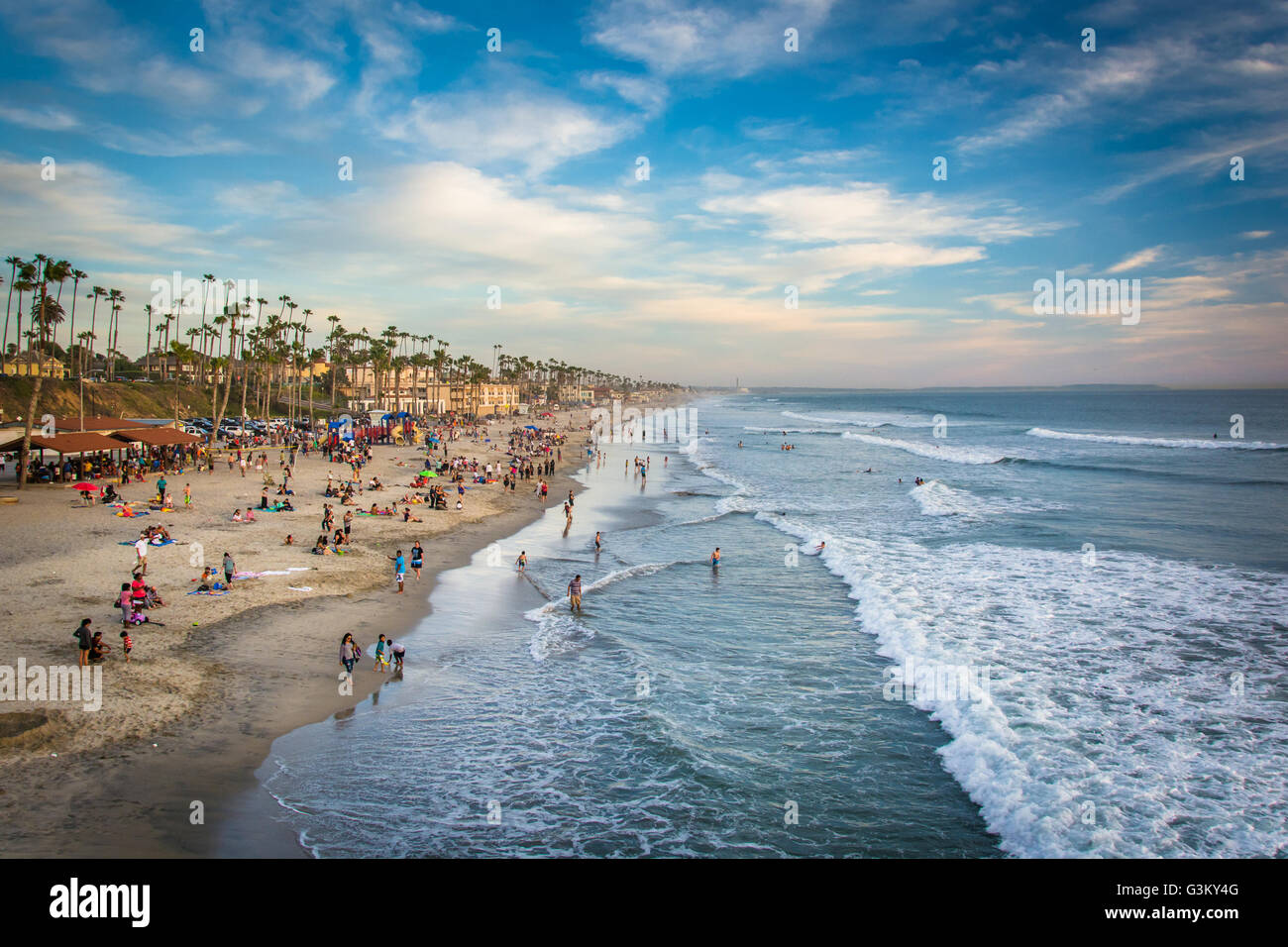 View of the beach from the pier at sunset, in Oceanside, California. Stock Photo
