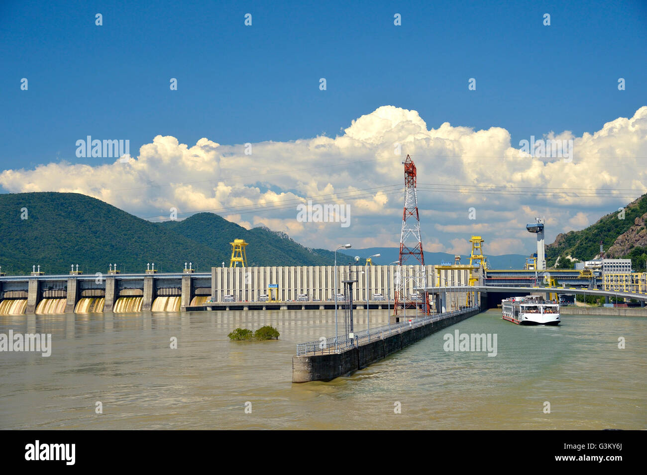 Passenger ship at water lock, hydro power plant in the Danube, power plant Kraftwerk Eisernes Tor 1, border between Serbia and Stock Photo