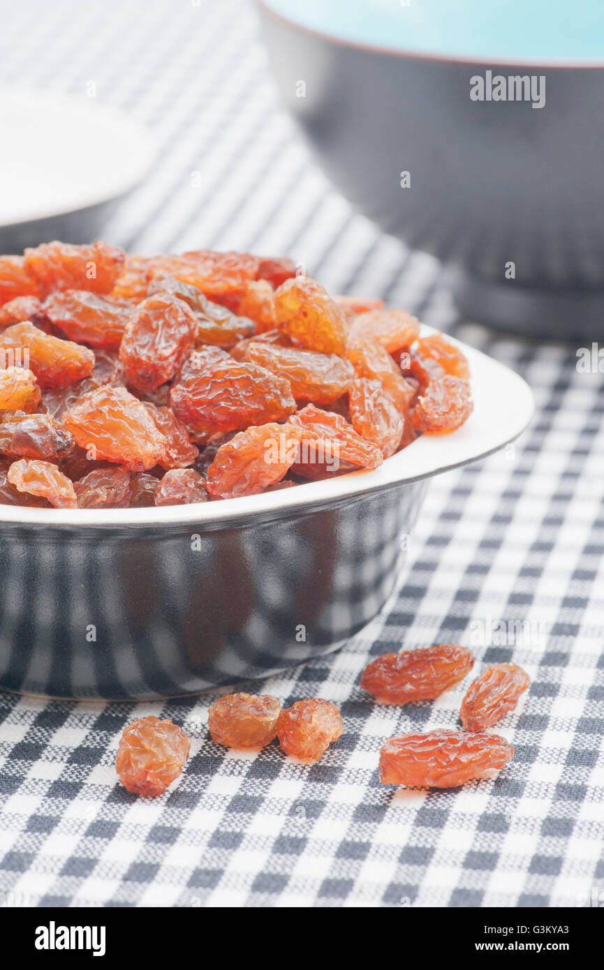 Bowl filled with raisins, sultanas Stock Photo