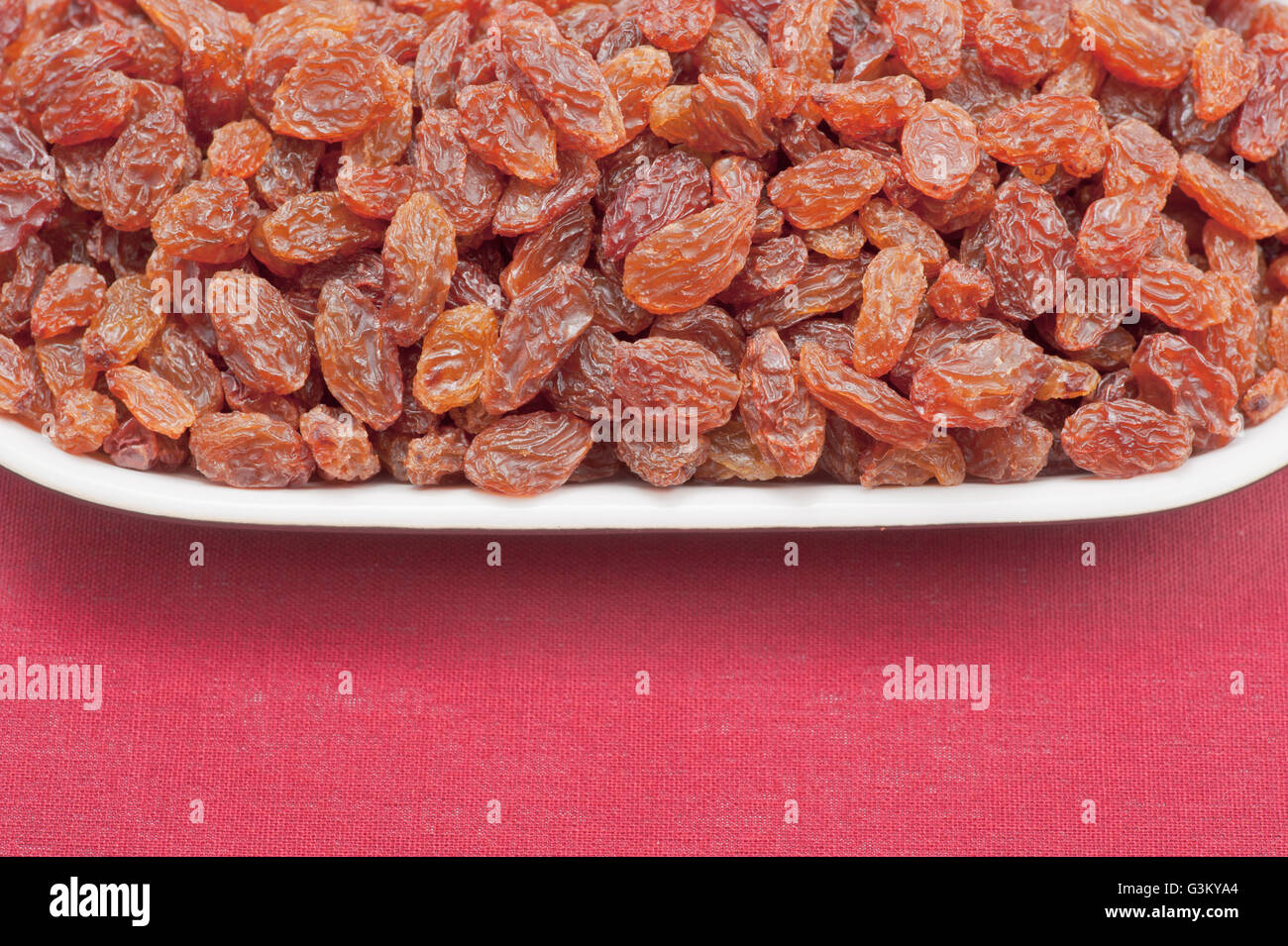 Plate filled with raisins, sultanas Stock Photo