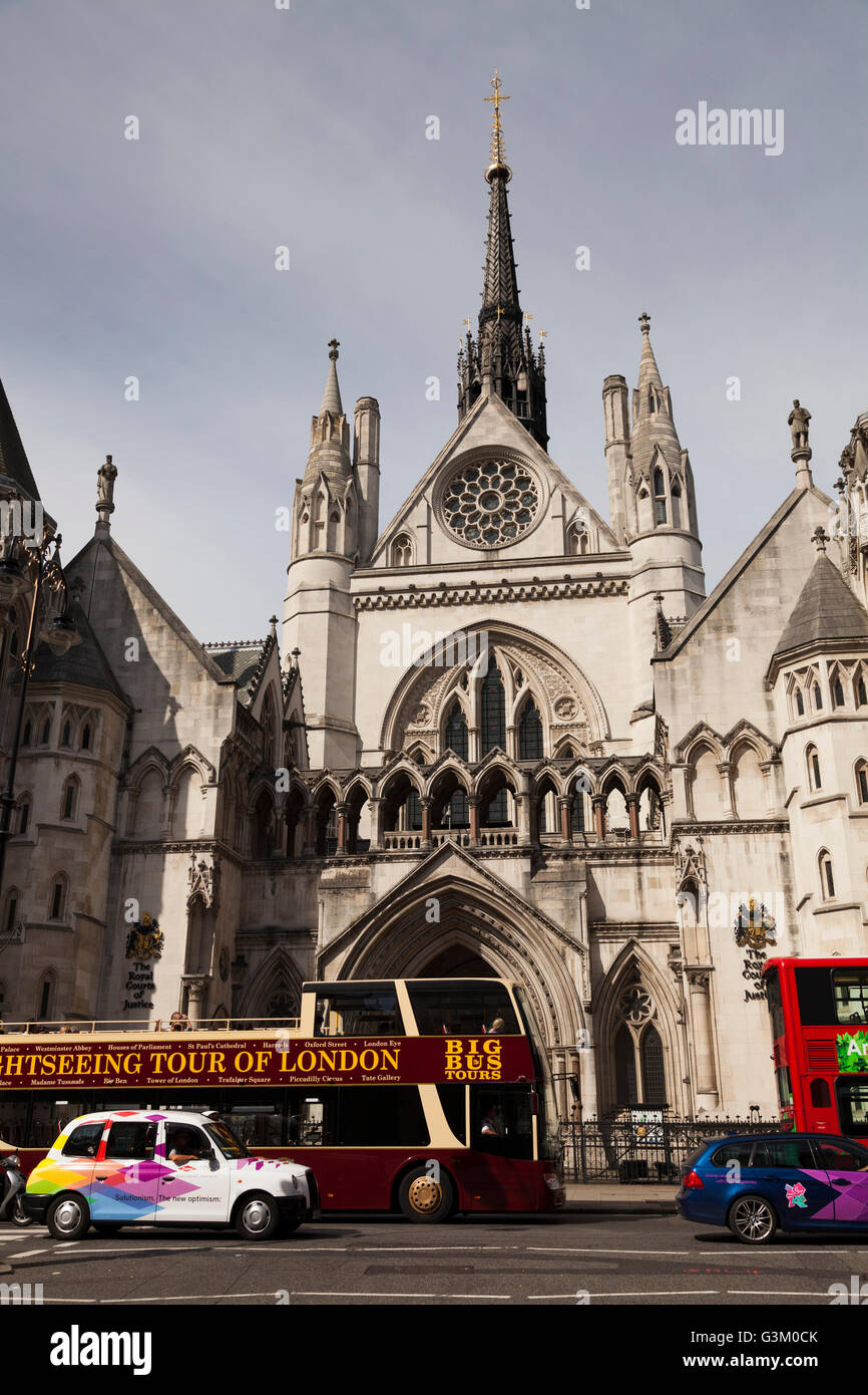 Sightseeing open topped bus and taxi outside the Royal Courts of Justice in Fleet Street, London, England, United Kingdom Stock Photo