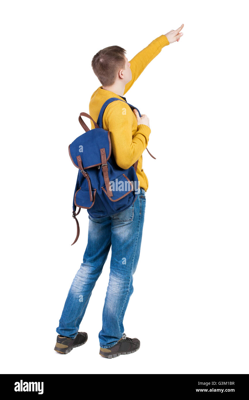 Back view of pointing young men with backpack. Young guy gesture. Rear ...