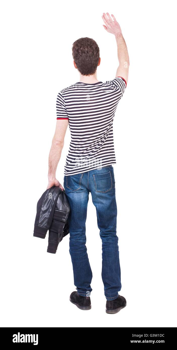 Back view of beautiful man man hand waving from. Rear view