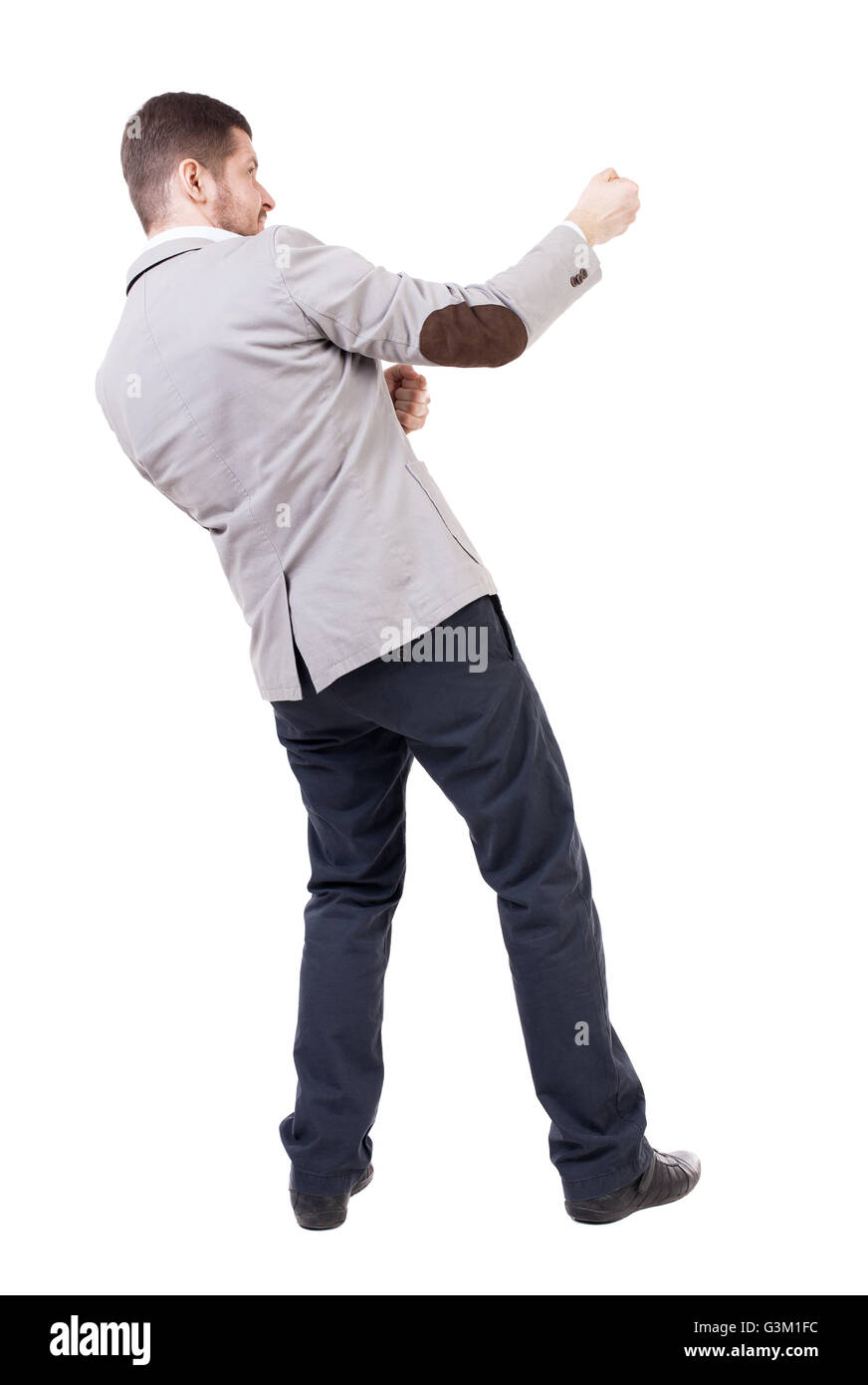 back view of standing man pulling a rope from the top or cling to  something. Rear view people collection. backside view of person. Isolated  over white background. Businessman pulling a rope something