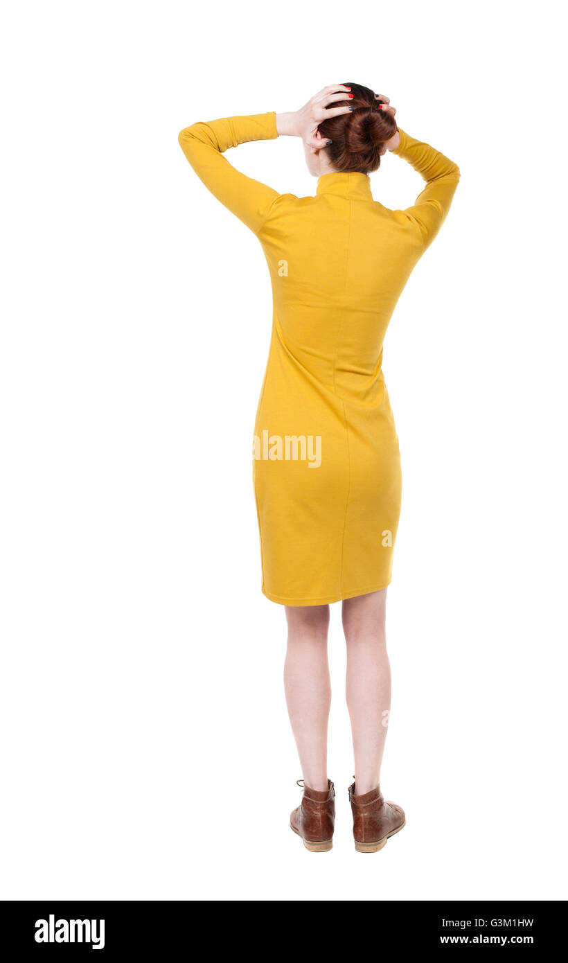 Back view of shocked woman in dress. upset young girl. Rear view people ...