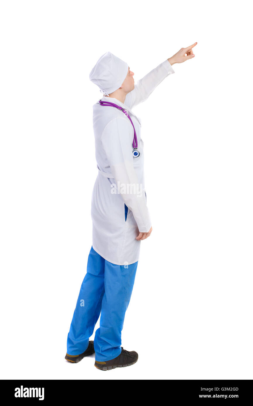 Side view of doctor in robe pointing. Standing young man. Rear view people collection. The nurse or doctor pointing up Stock Photo