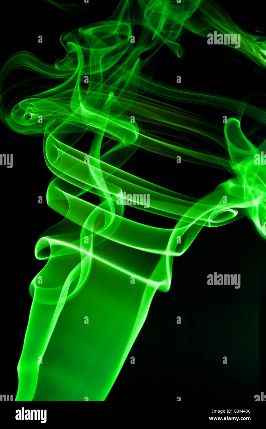 abstract green smoke . black background Stock Photo - Alamy