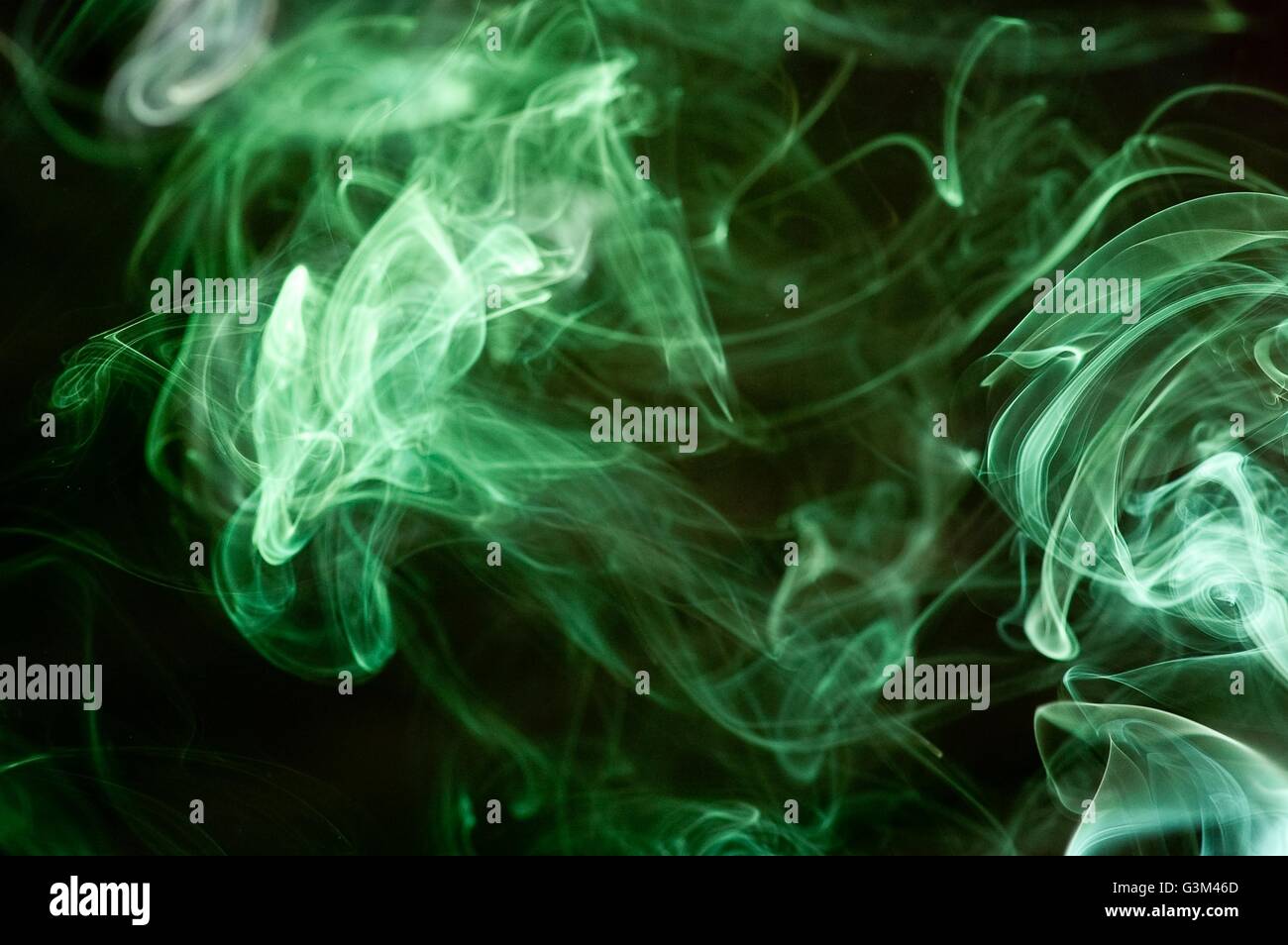 abstract blue smoke over black background Stock Photo - Alamy