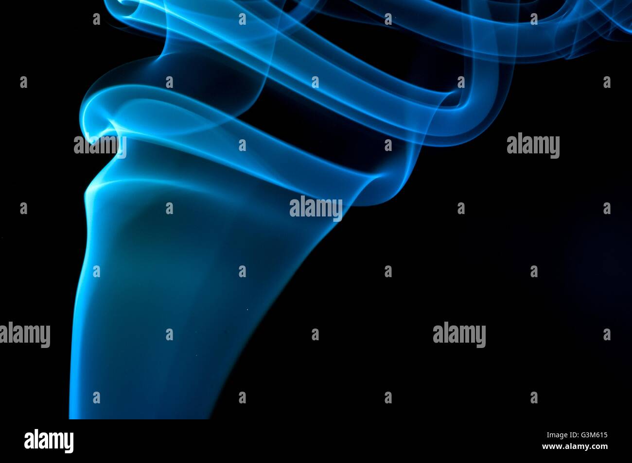 Abstract blue smoke over black background Stock Photo - Alamy