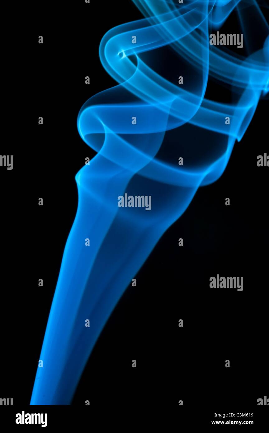 Abstract blue smoke over black background Stock Photo - Alamy