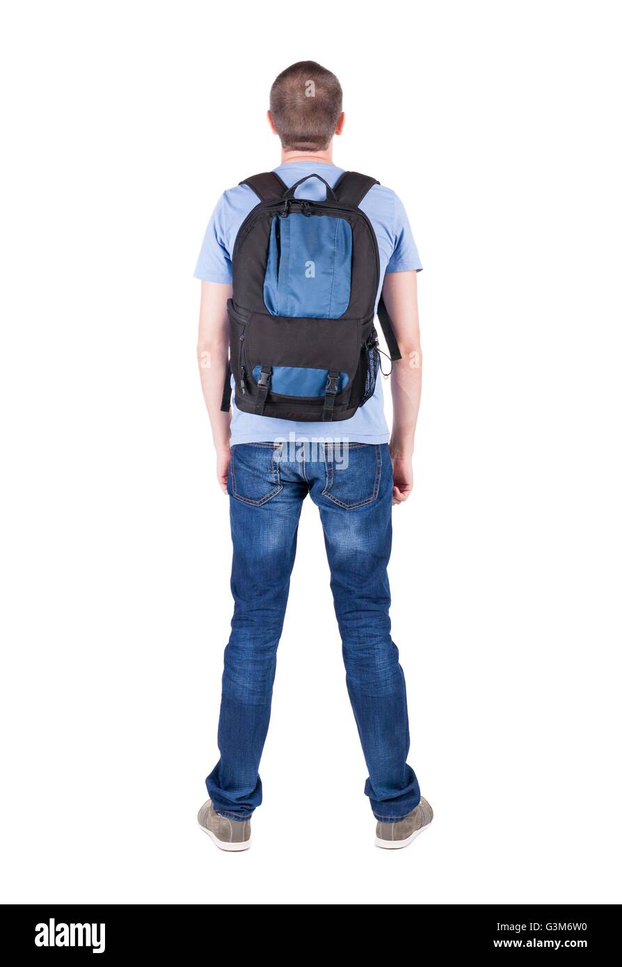 Back view of man with backpack looking up. Rear view people collection. backside view of person. Isolated over white background. guy in the green t-shirt stands with a suitcase on wheels Stock Photo