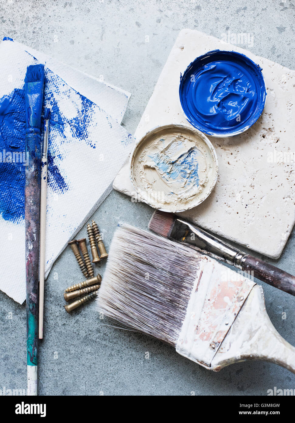 Brushes, paint and screws Stock Photo Alamy