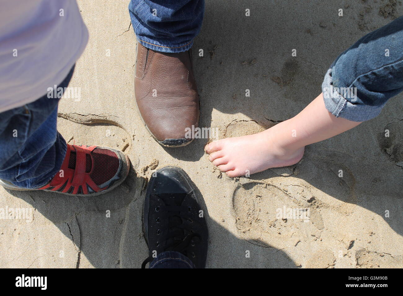 Sand, footprints, family holiday, Cornwall, four, 4 Stock Photo