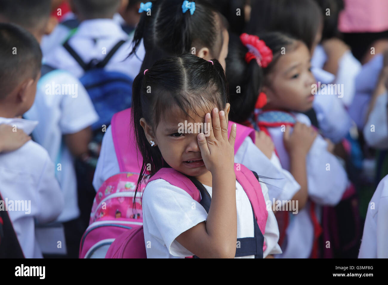 (160613) -- QUEZON CITY (THE PHILIPPINES), June 13, 2016 (Xinhua) -- A student cries during the first day of school at the President Corazon Aquino Elementary School in Quezon City, the Philippines, on June 13, 2016. Around 25 million students attended elementary and high school classes all over the country at the beginning of the school year 2016-2017, according to the Philippine Department of Education. (Xinhua/Rouelle Umali) Stock Photo