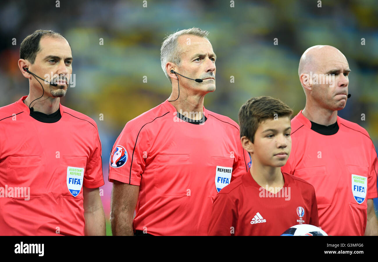 Lille, France. 12th June, 2016. Referee Martin Atkinson (C), assistant  Stephen Child and assistant Michael Mullarkey, all from England, prior to  the UEFA Euro 2016 Group C soccer match between Germany and