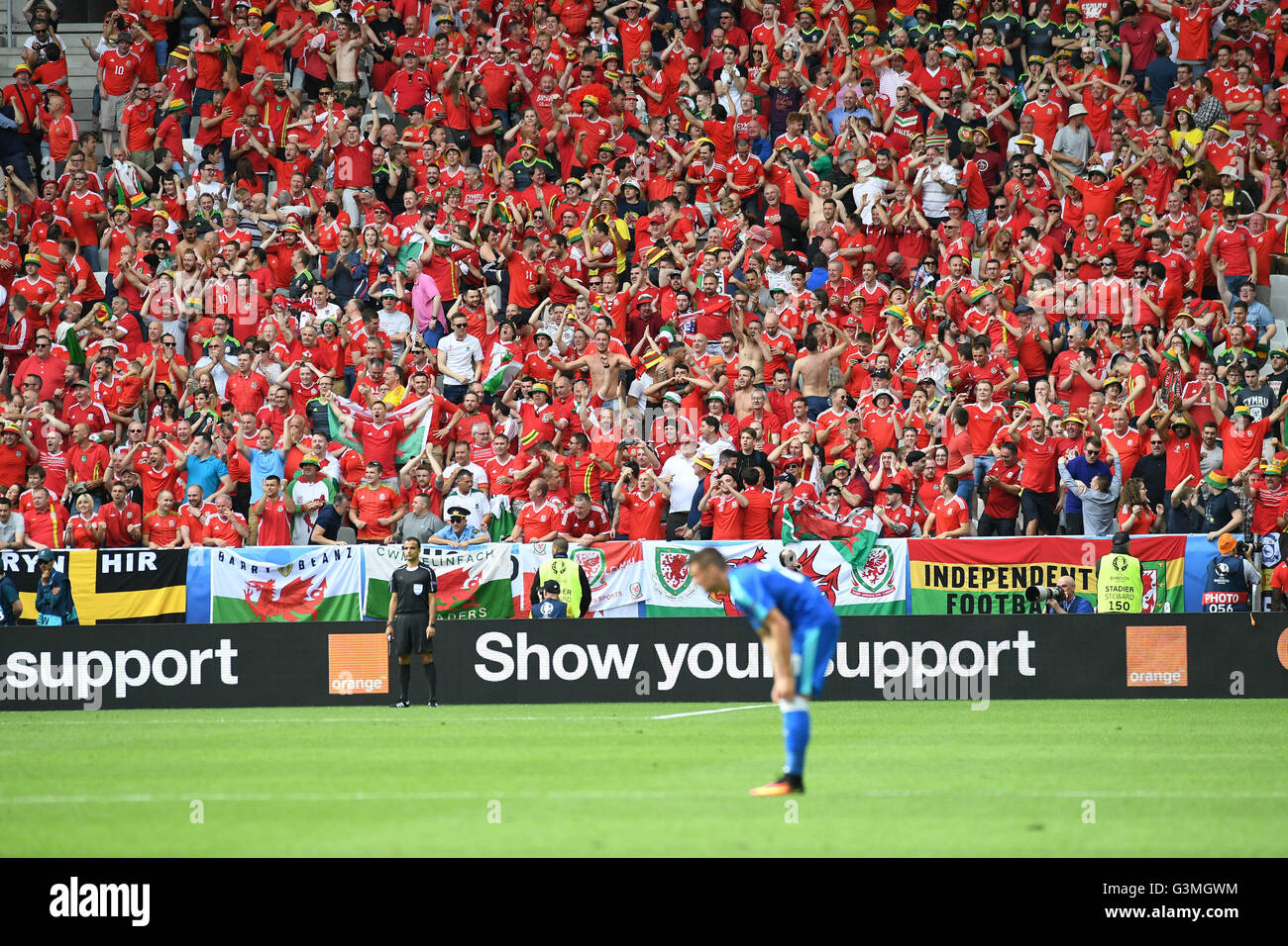 A sea of red Welsh fans wearing red as Wales take on Slovakia in their Euro 2016 Group B fixture at the Matmut Atlantique , Nouveau Stade de Bordeaux  in Bordeaux, France on Saturday 11th June 2016. Stock Photo