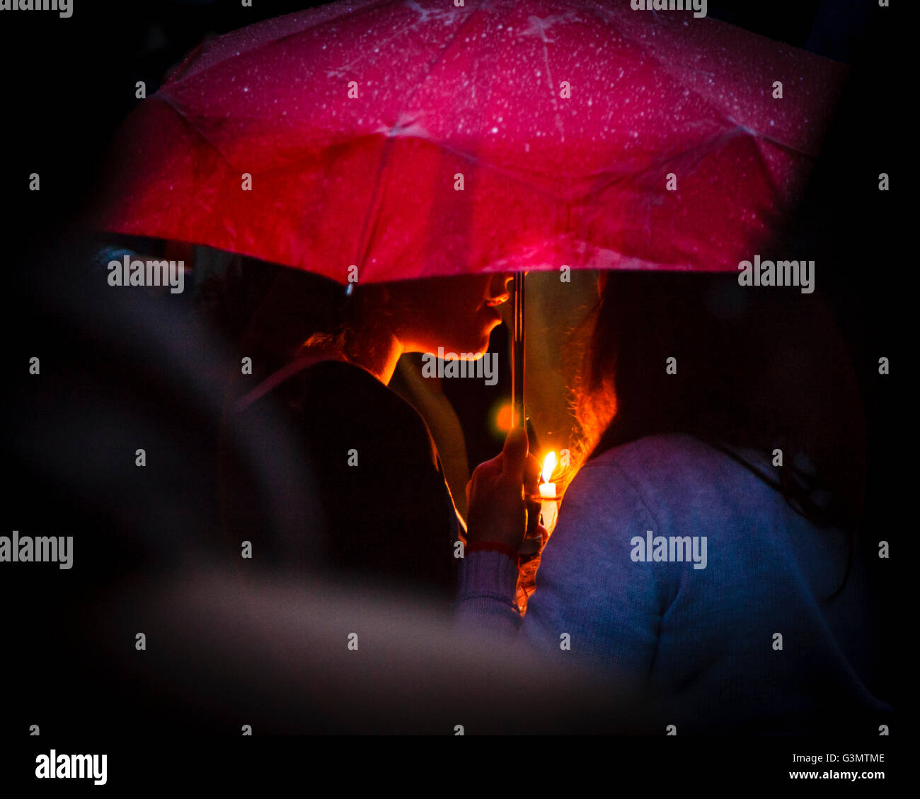 Manchester, UK 13th June, 2016 At the vigil in Sackville Gardens people show their respect and support for the victims of the Orlando killings Credit:  Graham Hardy/Alamy Live News Stock Photo