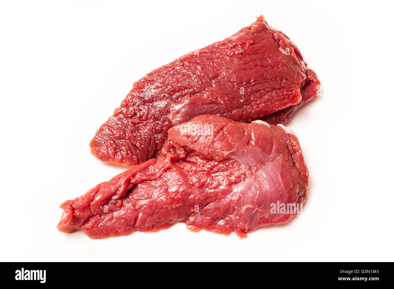 Uncooked kangaroo meat steaks  isolated on a white studio background. Stock Photo