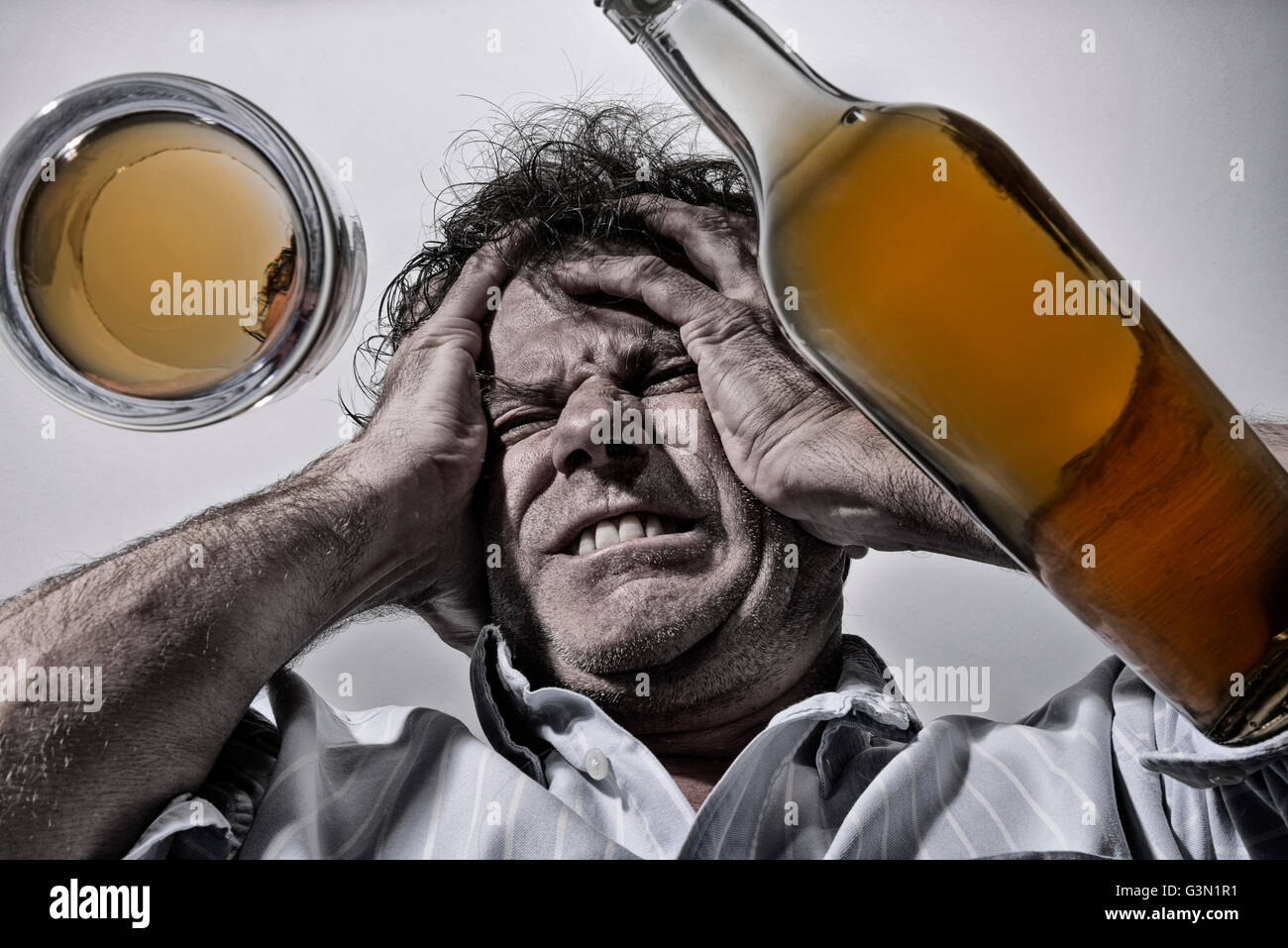 Mature man with alcohol problems Stock Photo