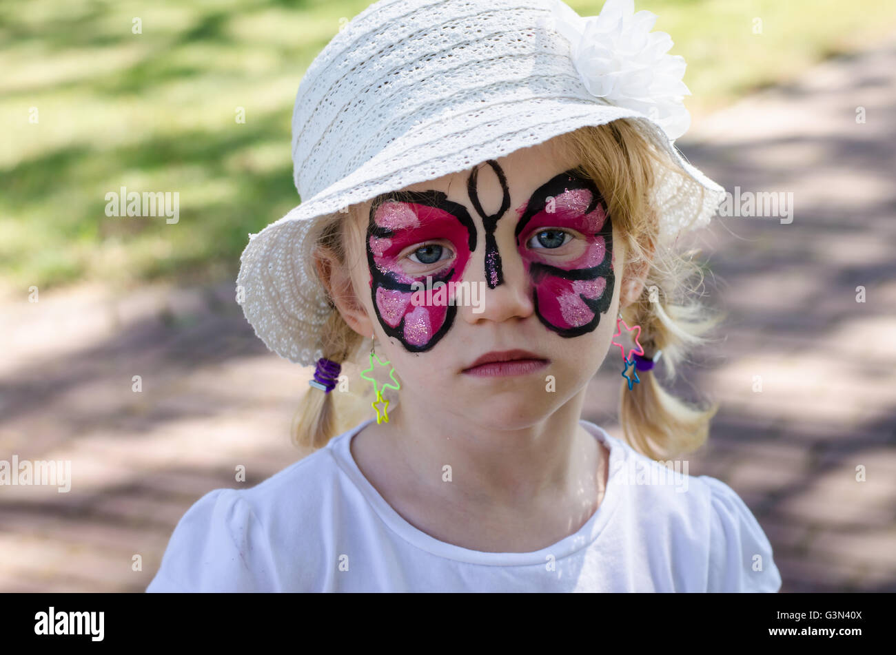 blond girl with face painting Stock Photo