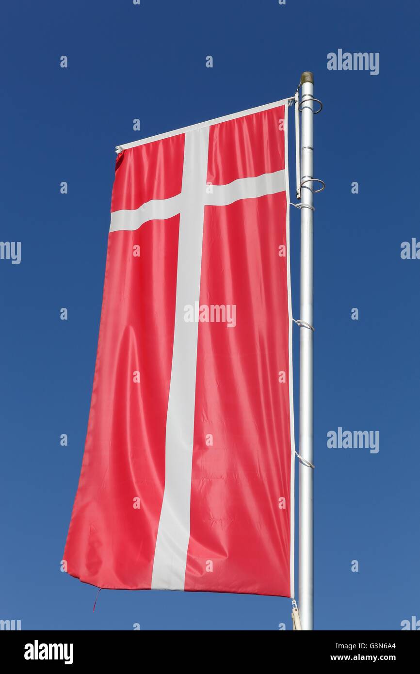 Flag of Denmark waving in the sky Stock Photo