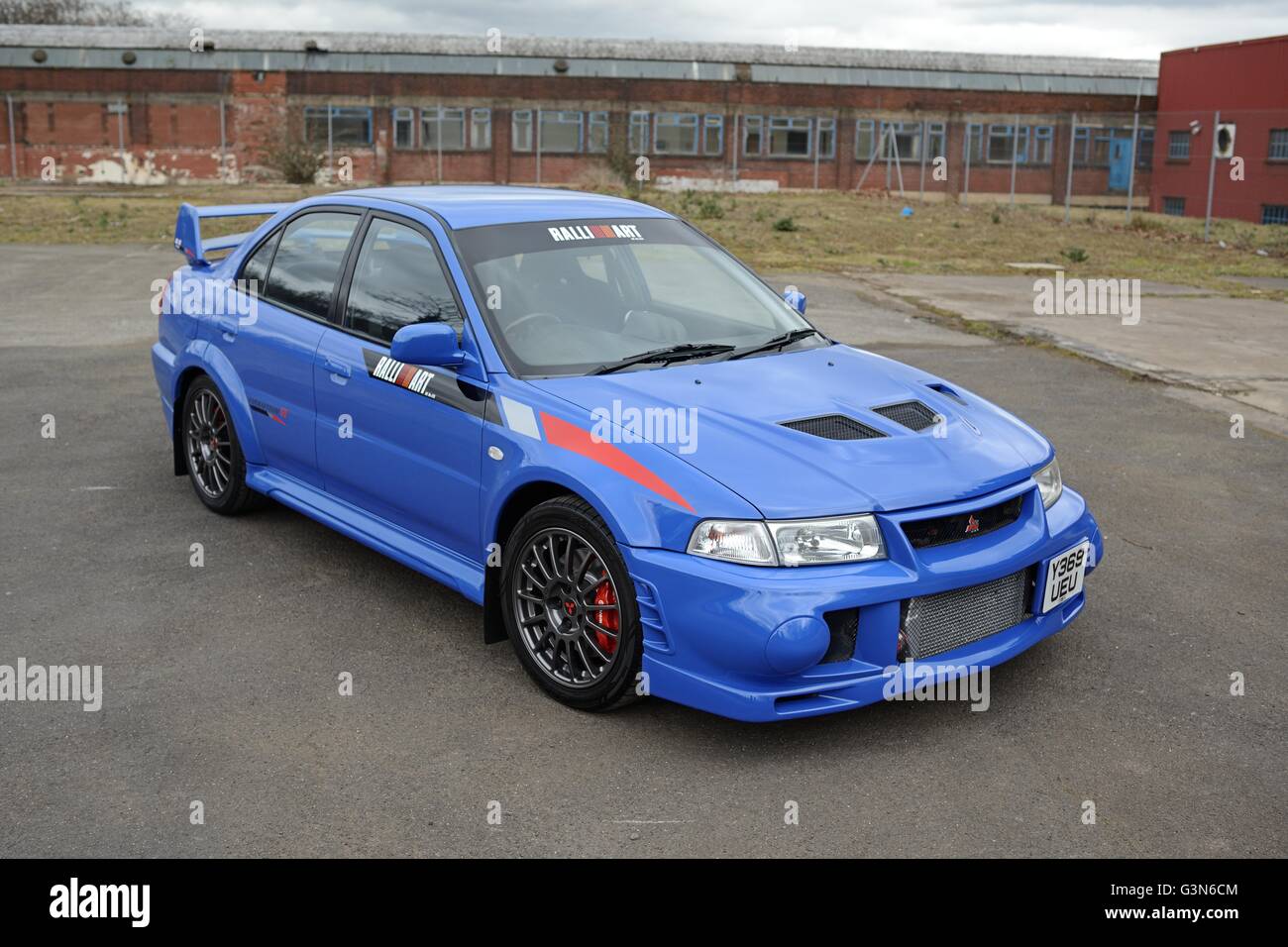 Mitsubishi EVO VI Ralliart GSR parked on a disused industrial site