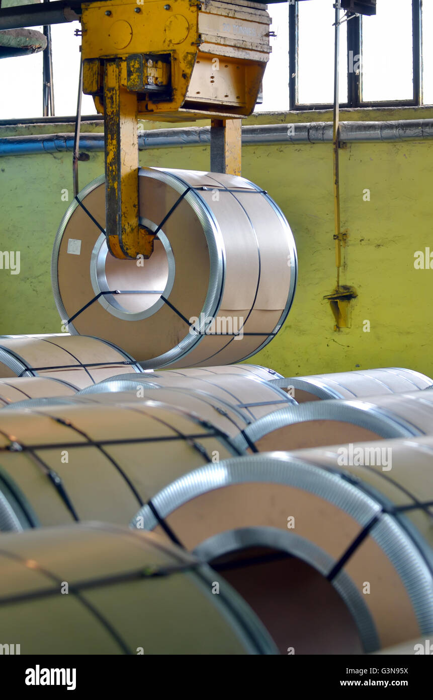 Steel coil in warehouse and crane Stock Photo