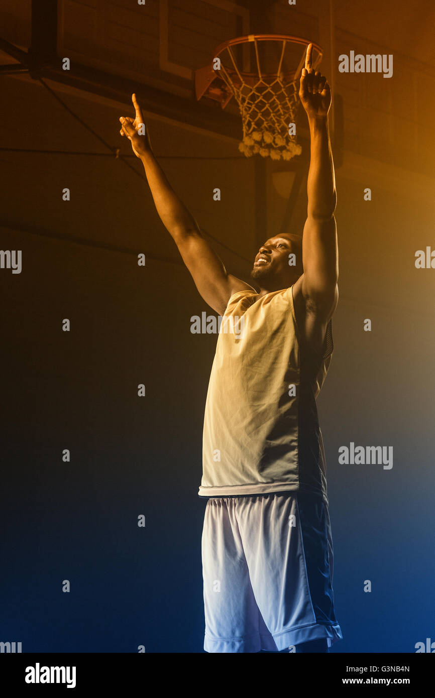Portrait of basketball player throwing arms for the victory Stock Photo
