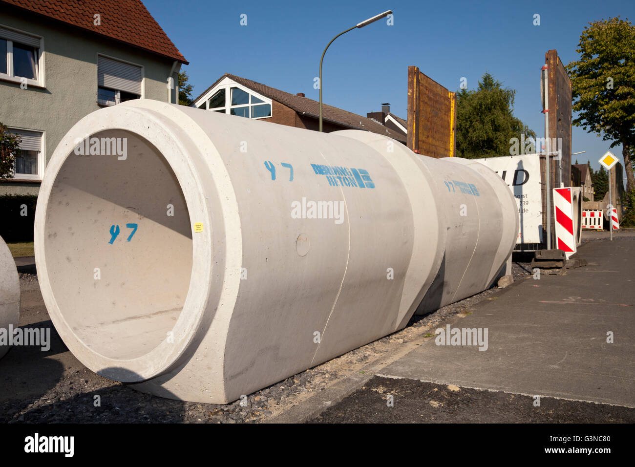Concrete pipes for the renewal of the sewerage system, construction site for road rehabilitation, Koenigstrasse, Kamen Stock Photo