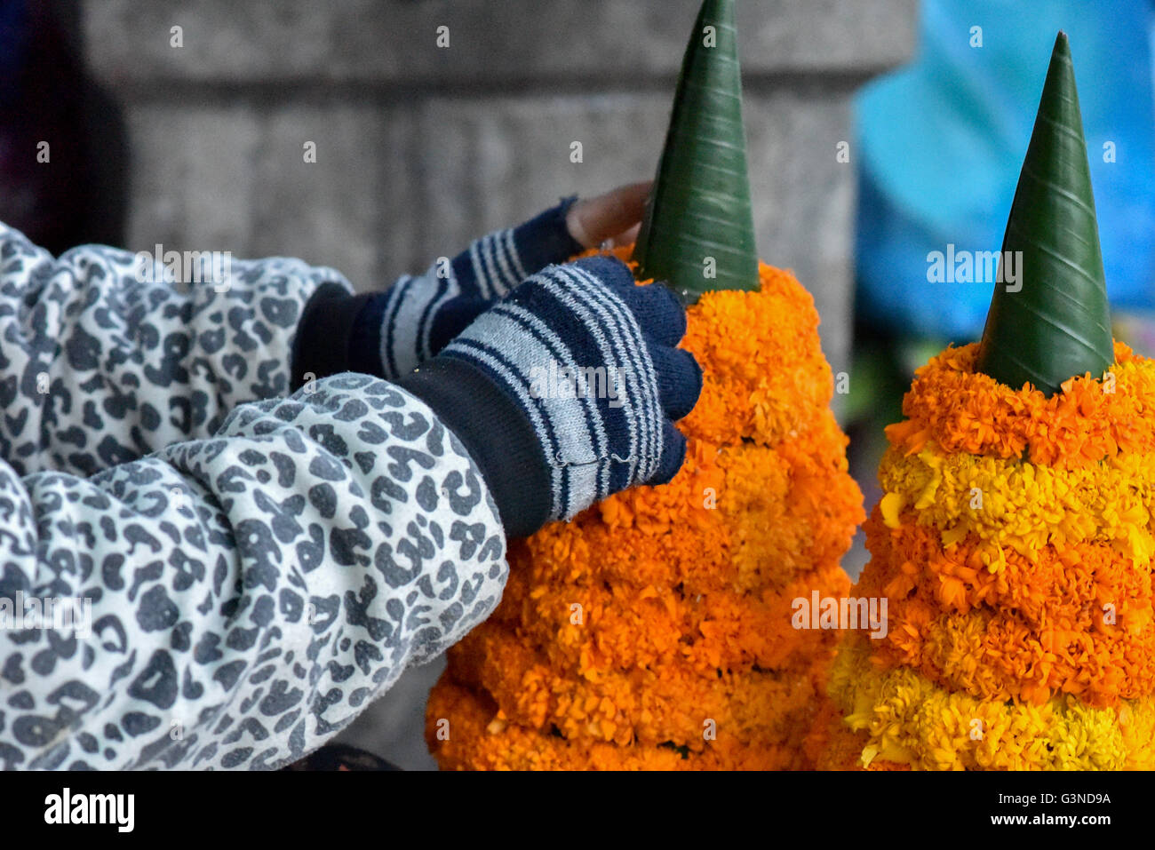 “Banana-leaf tower” (Kong Than) made with orange flowers typically used for rituals and ceremonies in Laos Stock Photo