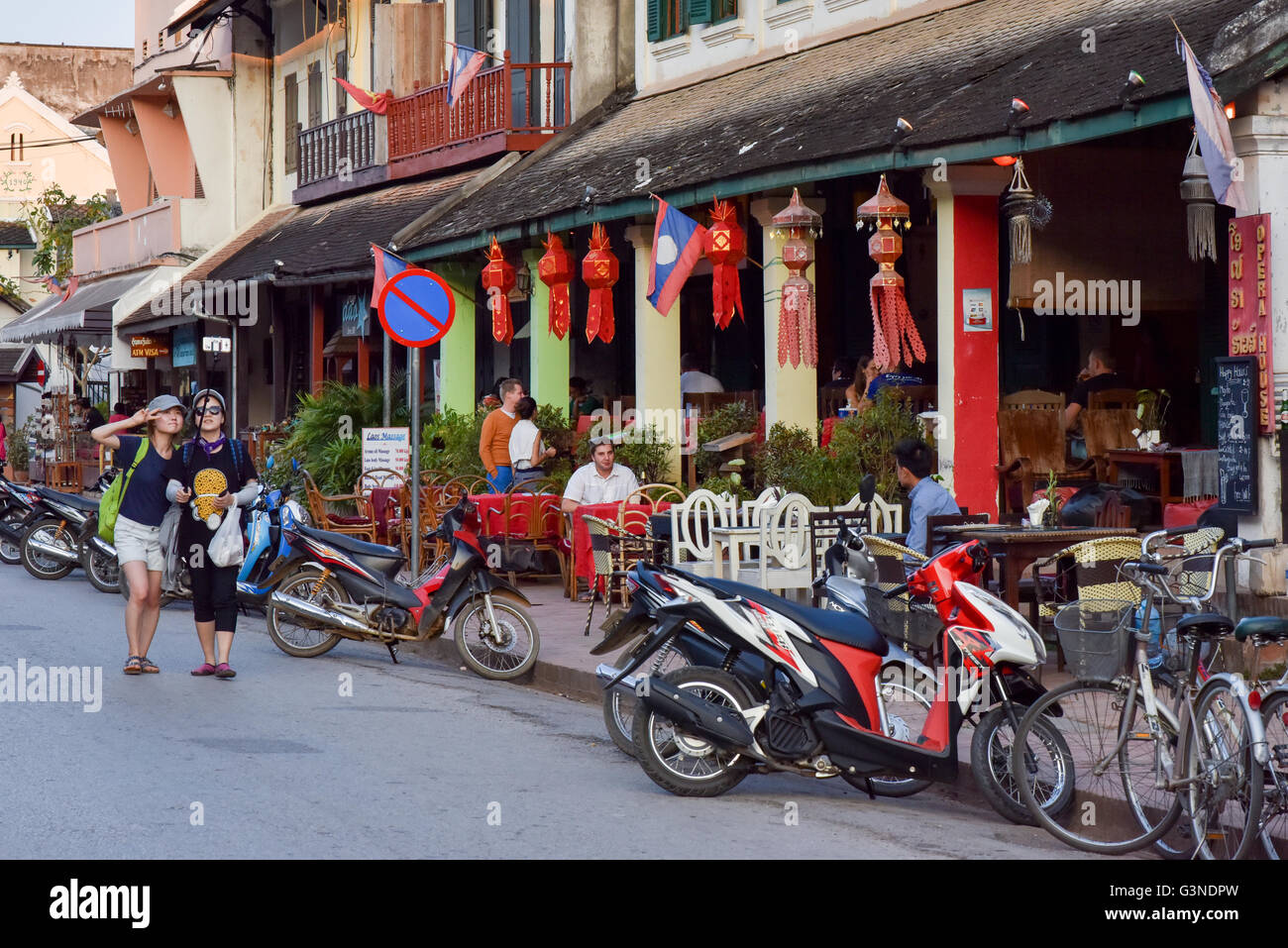 Luang Prabang Laos, Tourists taking selfies on main commercial street Stock Photo