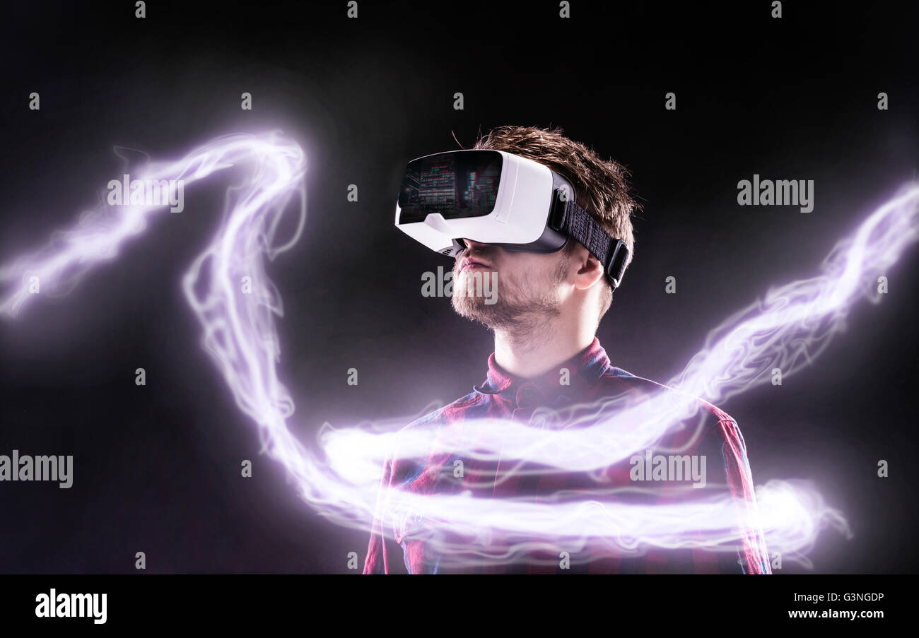 Man wearing virtual reality goggles. Studio shot, black backgrou Stock ...