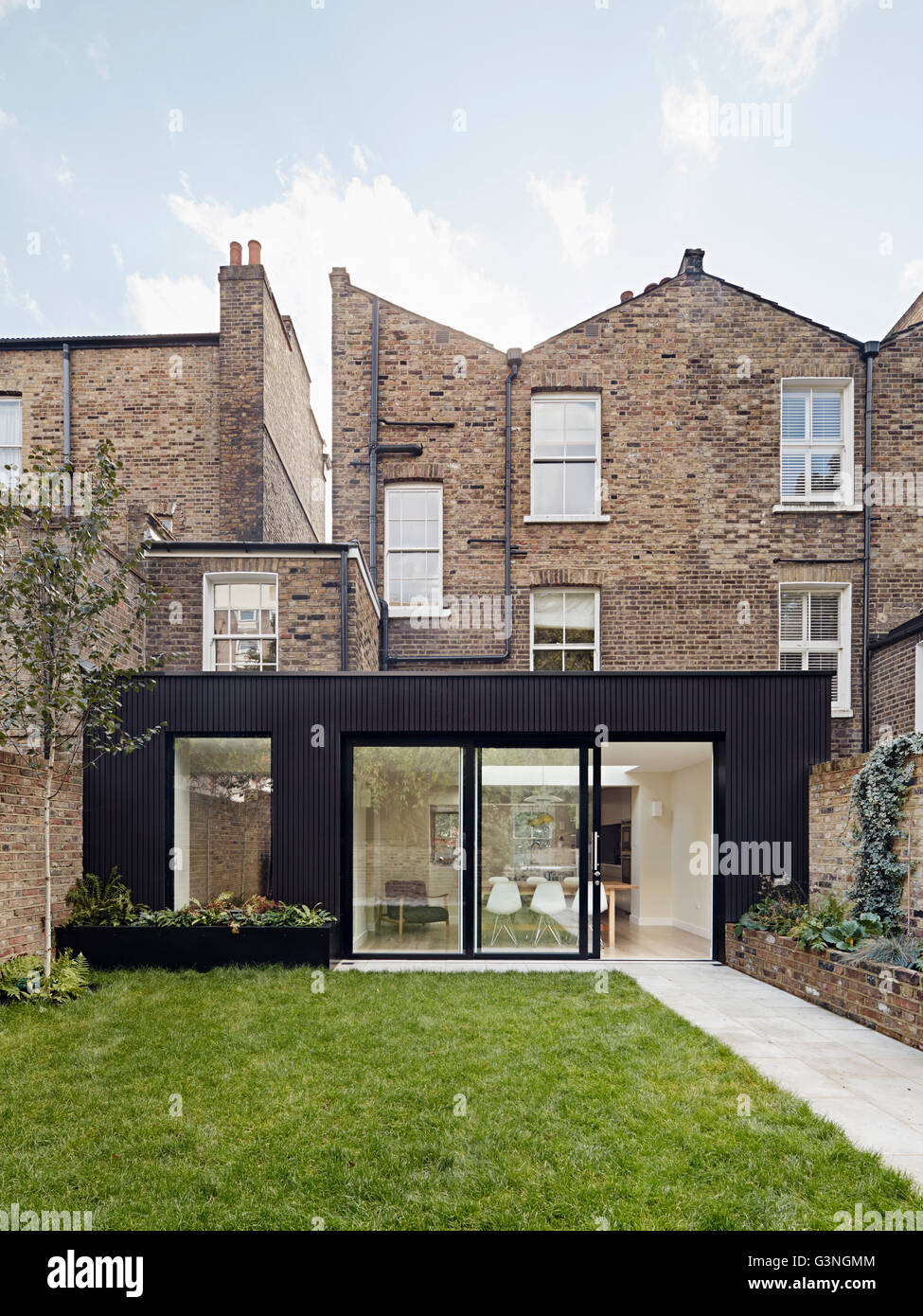 Garden view of extension. Ockendon Road, London, United Kingdom. Architect Nissen Richards