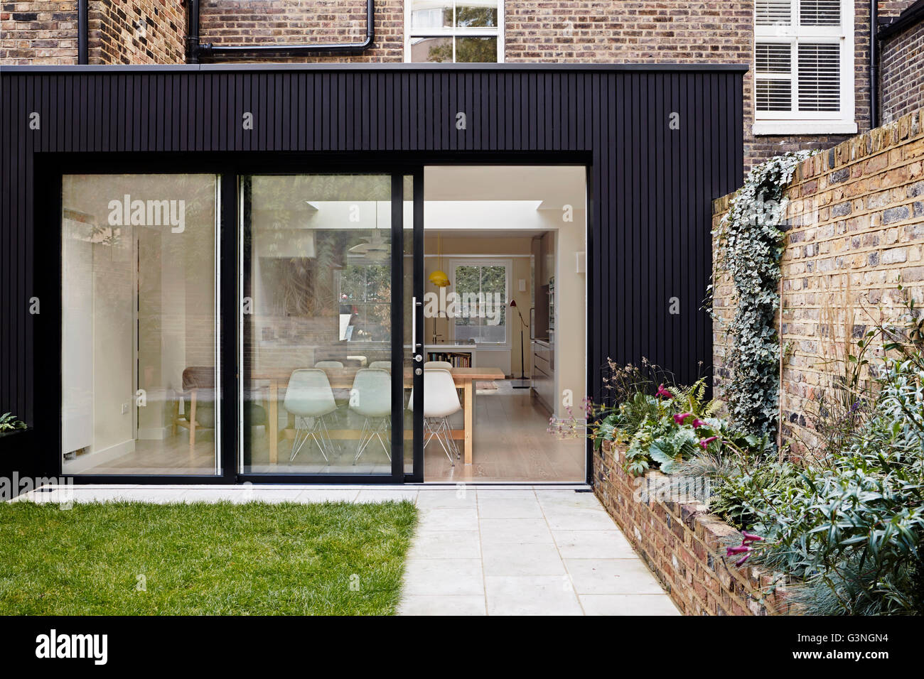 Sliding door leading to kitchen diner. Ockendon Road, London, United Kingdom. Architect Nissen