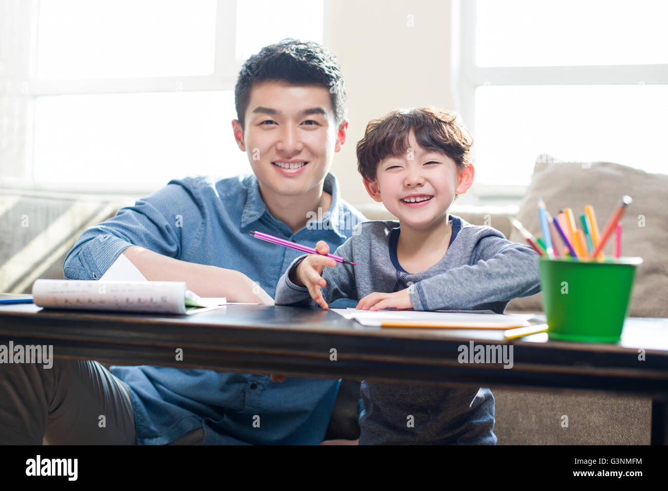 Young father helping son with homework Stock Photo - Alamy