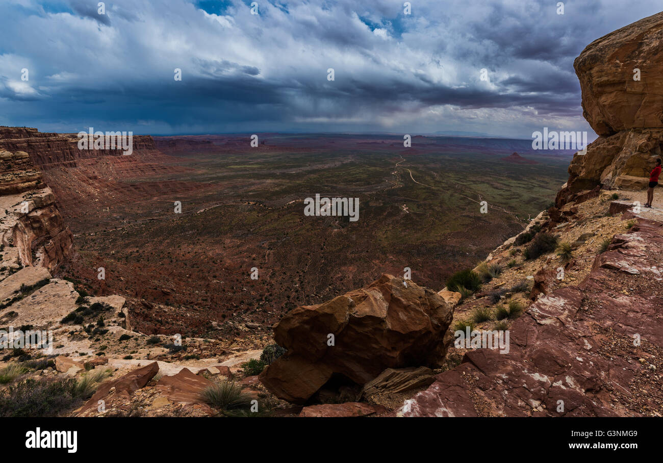 Woman looking down the Valley of the Gods form Moki Dugway Overllook Stock Photo