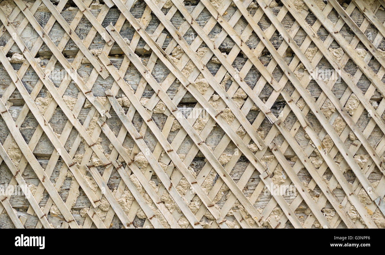 Lath of shingles for the application of the plaster on the wall background texture. Stock Photo