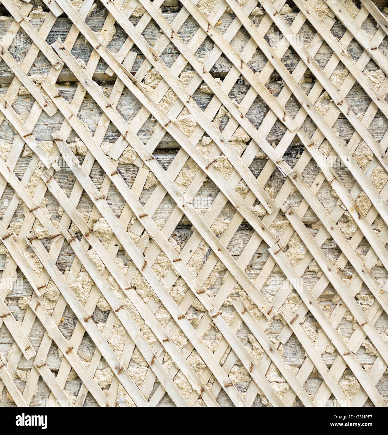Lath of shingles for the application of the plaster on the wall background texture. Stock Photo
