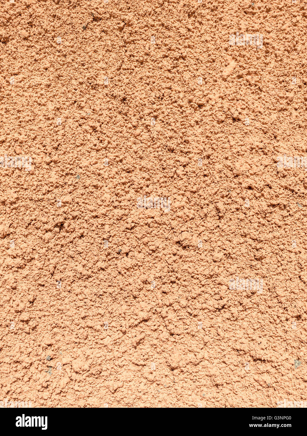 Painted textured surface of wall covered with terracotta stucco background texture Stock Photo