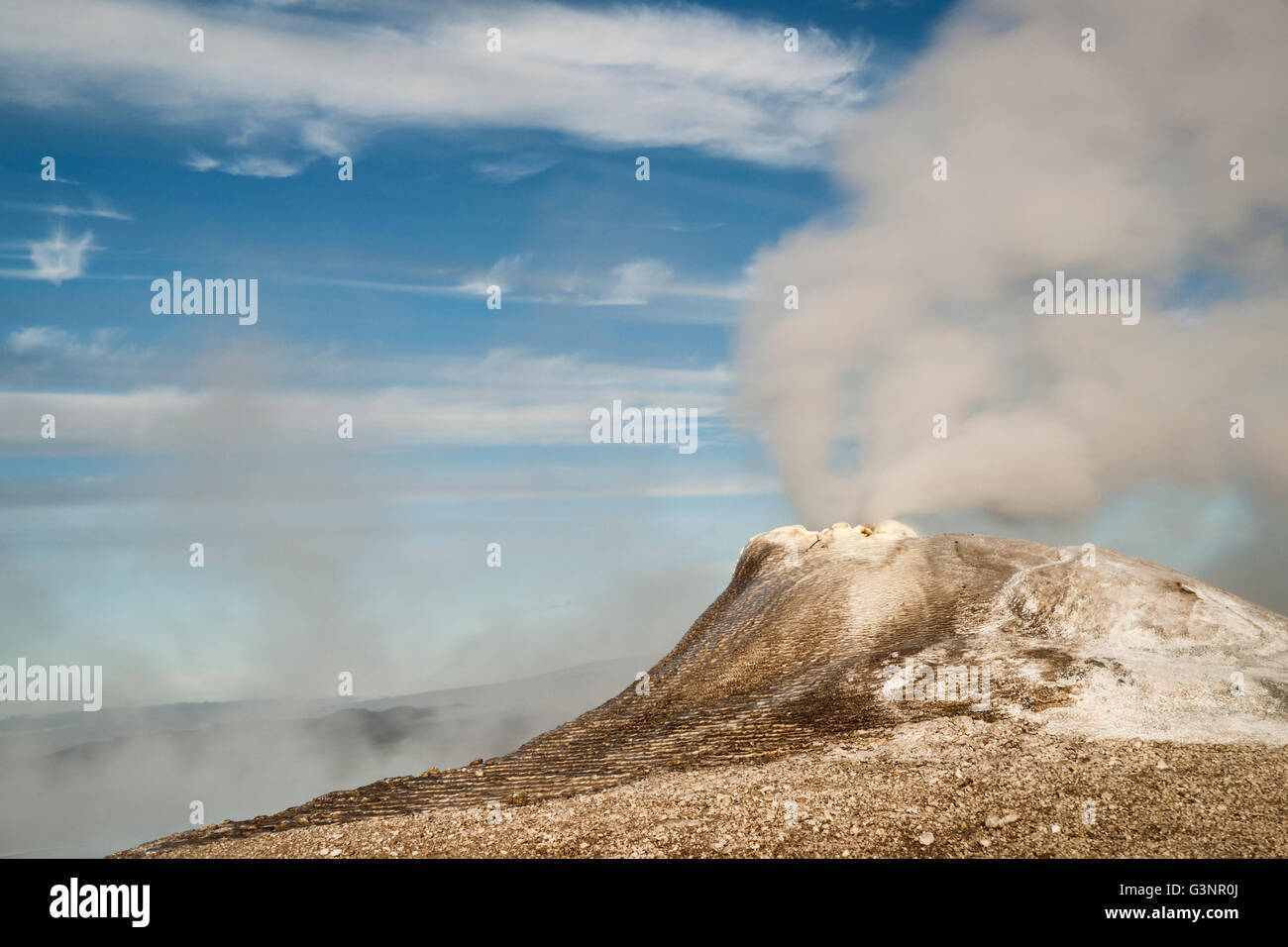 Geothermal hot spring at Hveravellir with mist and steam erupting from a fumerole, Kjolur Route, Interior, Iceland Stock Photo