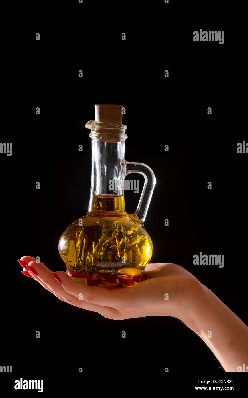 Bottle of olive oil with fresh herbs Stock Photo - Alamy