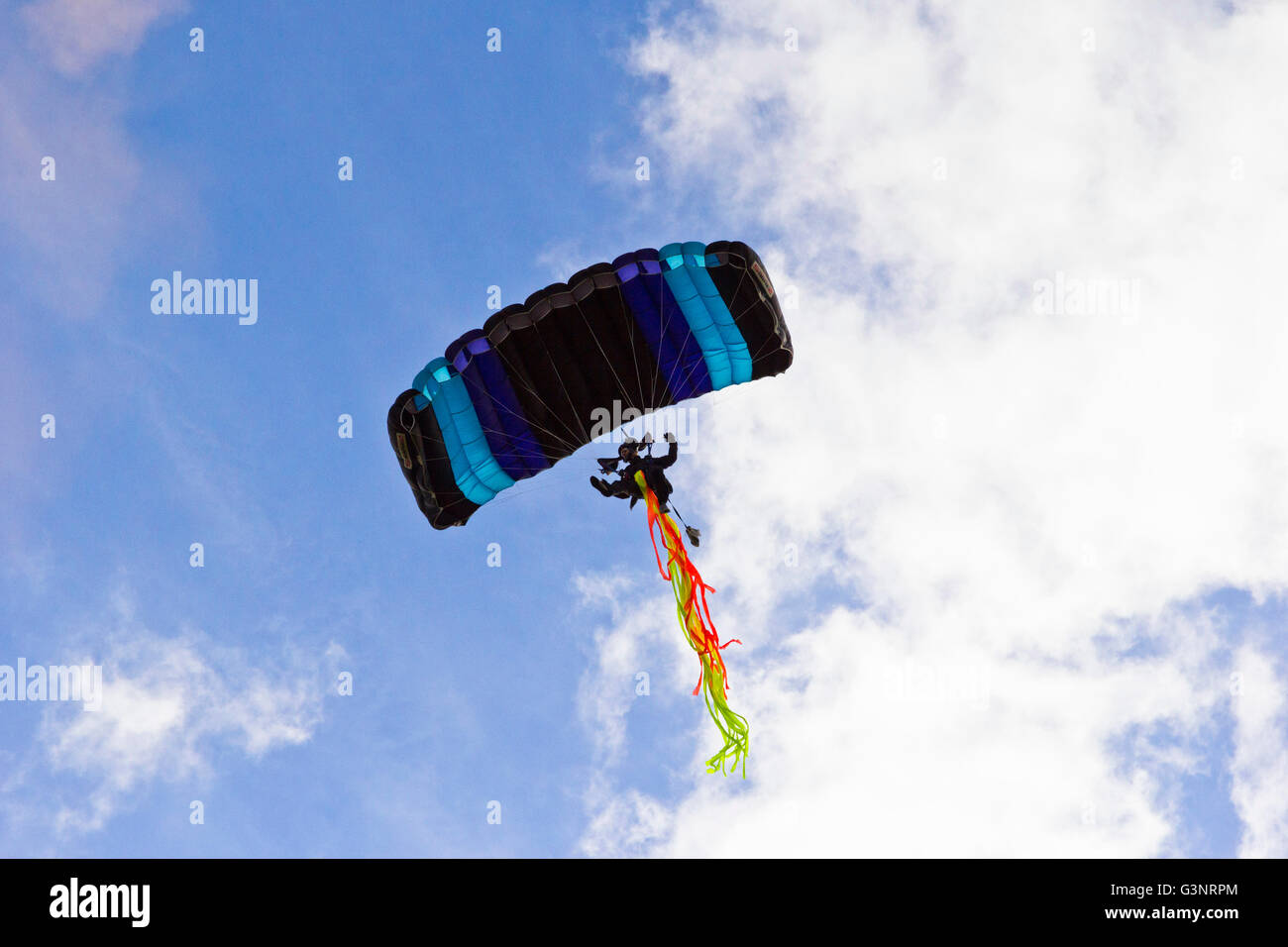 Parachutist coming in to land Stock Photo