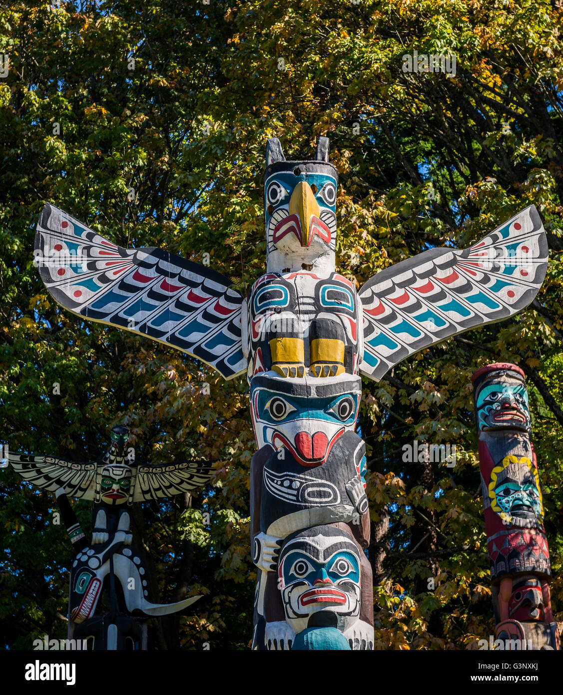 Photo of the colourful totems on a sunny day. Stock Photo