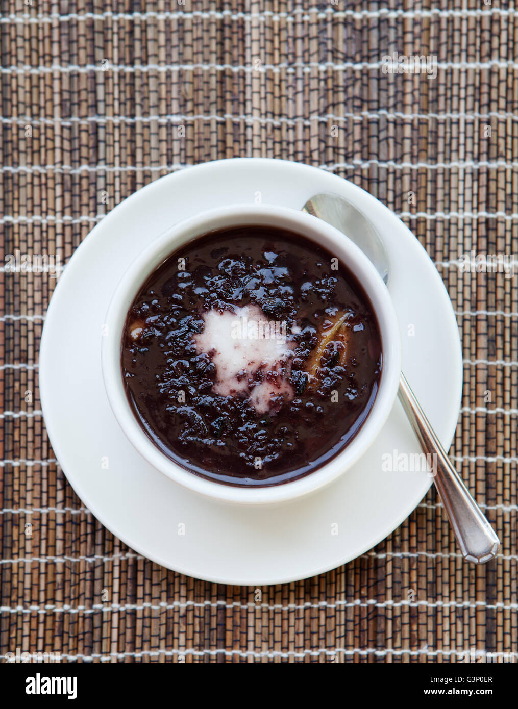 Black sticky rice pudding with coconut milk Stock Photo Alamy